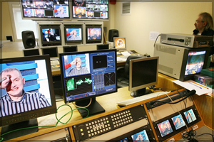 Behind-the-scenes view of a television broadcasting room.